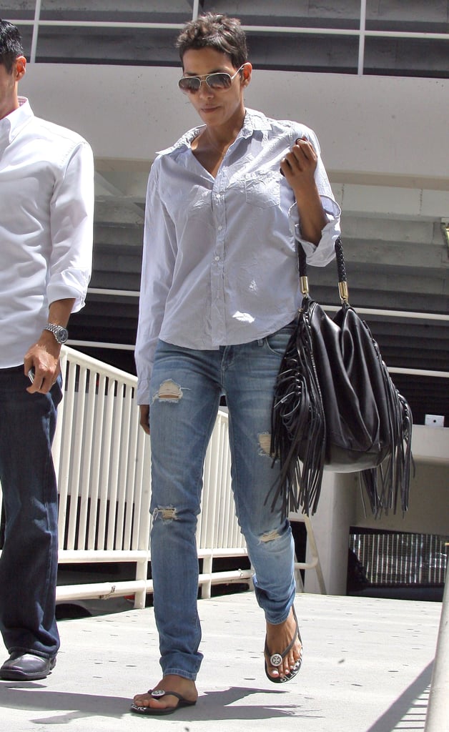 A wrinkled button-down and ripped jeans look sexy, not tired, on Halle.