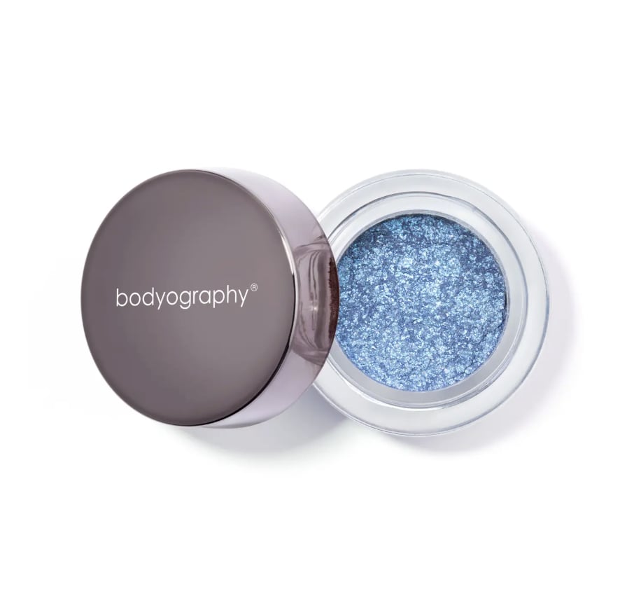 Bodyogrophy Glitter Pigment ($25)
Who says your touch of blue has to be worn? Let it glow instead. This glitter pigment doubles as eyeshadow or a soft wash of blue shimmer on your shoulders and chest, adding just the right amount of sparkle. It's the easiest way to level up your outfit — no extra layers required.