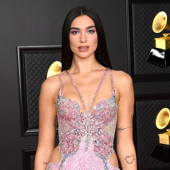 Dua Lipa Wears a Leather Bra Top and Front Cutout Trousers