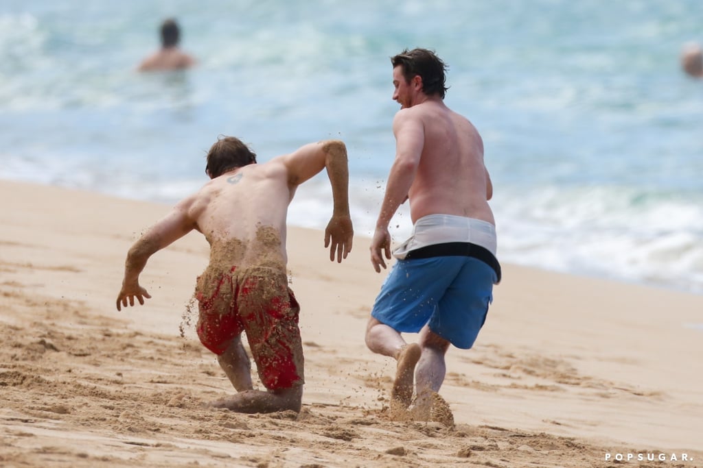 Charlie Hunnam and Garrett Hedlund Wrestle in Hawaii Photos