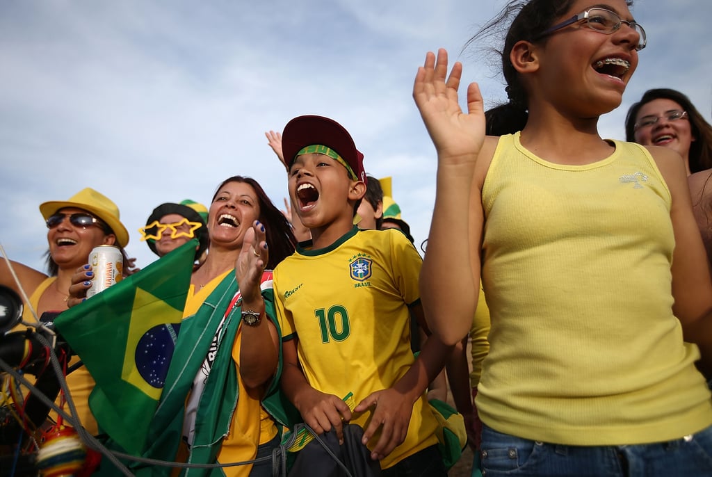 Brazil fans cheered as they stood outside Itaquero Stadium during the World Cup opening ceremony rehearsals.