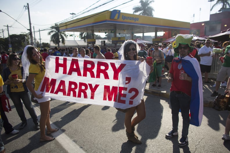 These fans in Brazil went one step further by wearing veils to go along with their marriage proposal.