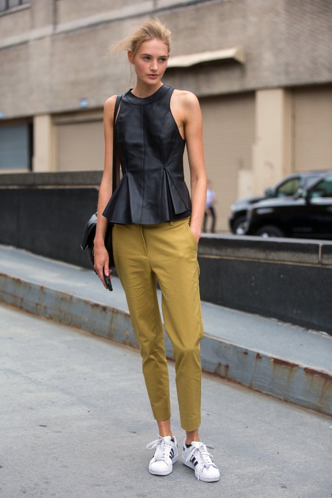 Dress down a leather halter top and trousers with a pair of sneakers.