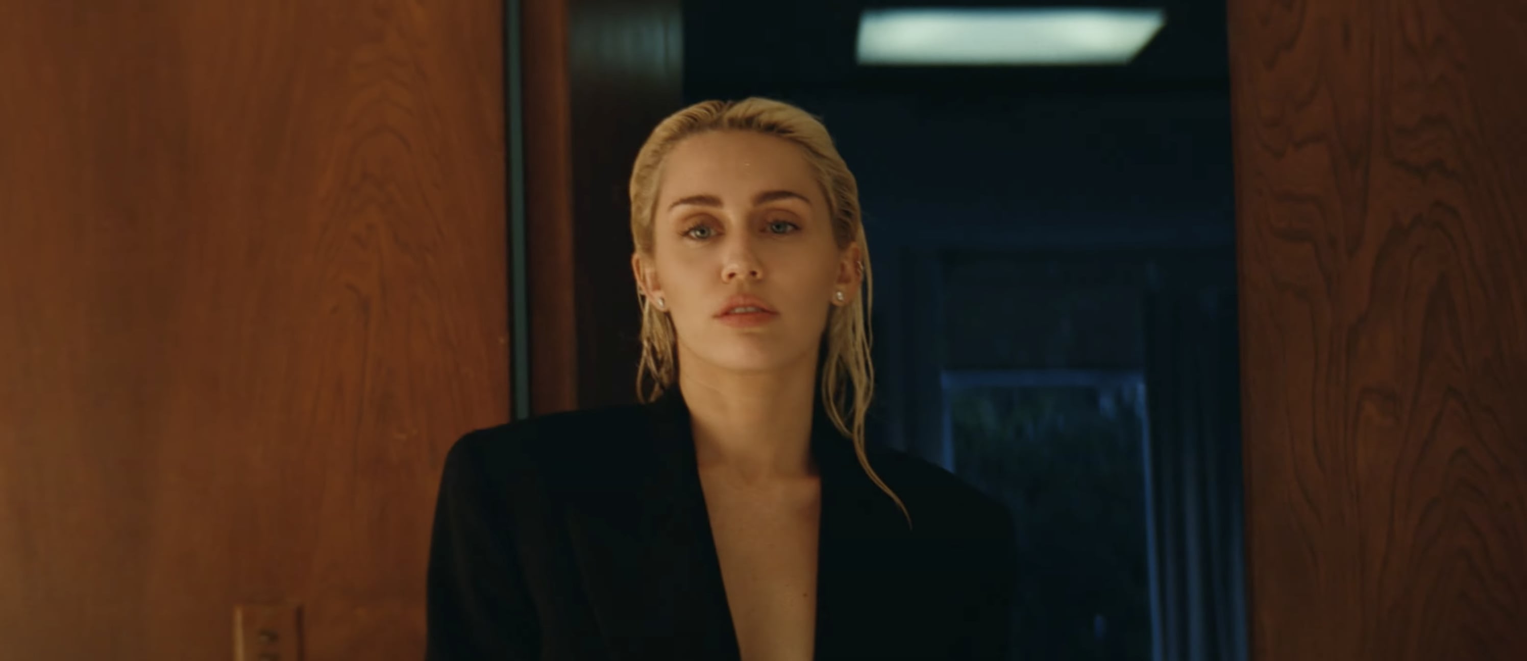 Miley Cyrus Wears Gold Cutout Dress in "Flowers" Music Video | PS Fashion