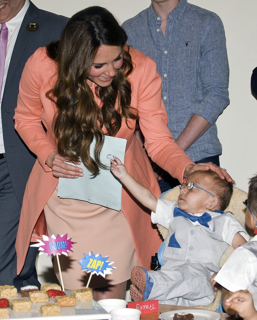 Kate shared a precious moment with a little boy while visiting England's Naomi House Children's Hospice in April 2016.