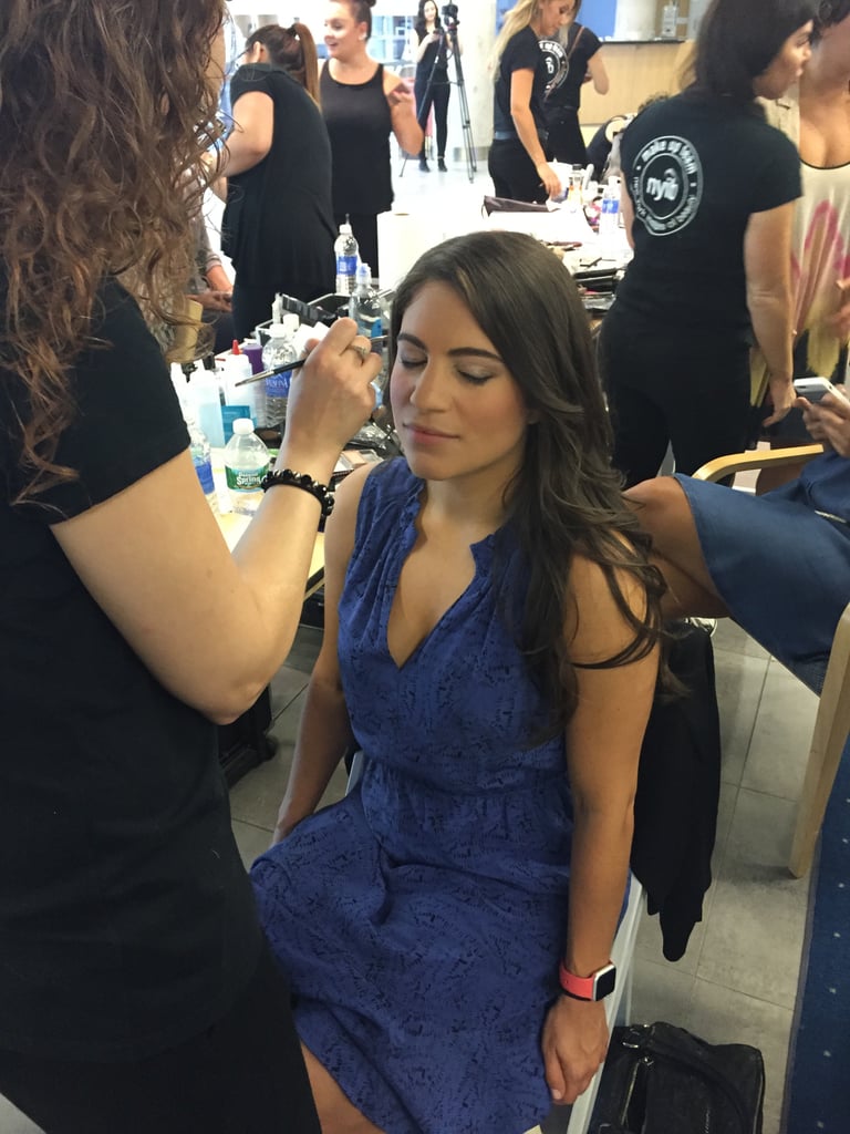 On the show day, I woke up, showered, and did two face masks while I blow-dried my hair. First, I got rid of dead skin cells with the Tata Harper Resurfacing Mask — it's gentle enough to ensure there would be no red-faced aftermath. I followed it with a hydrating sheet mask by Leaders. Throwing my beige heels in my bag, I ran out the door to the Mercedes-Benz showroom.  
It looked like a typical backstage, with a team from New York Institute of Beauty heading up the glam squad. Our own Jessica Cruel was even  there interviewing the role models. Each model was allowed to choose a hair and makeup look inspired by our personal style, so I went with glossy beach waves and a power-pink pout.