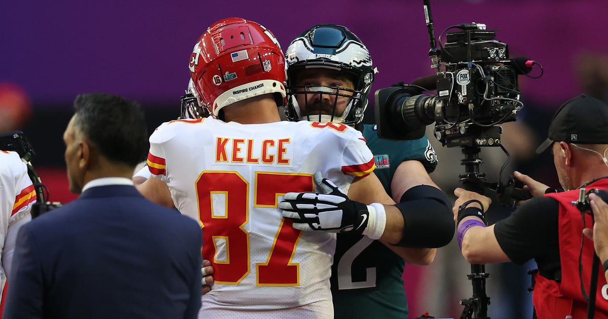 Brothers Jason and Travis Kelce share a sweet hug during the 2023 Super Bowl