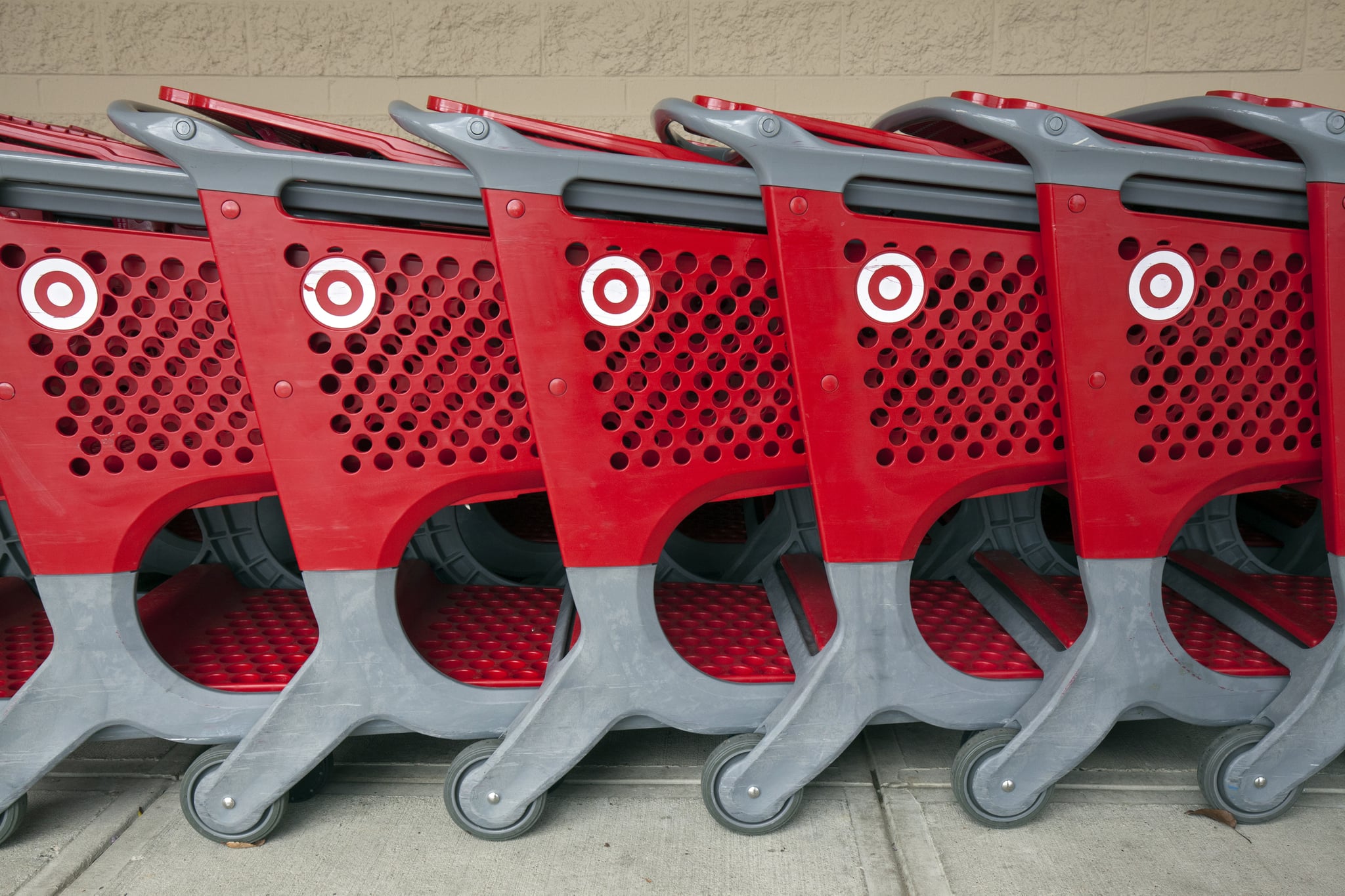 View of branded shopping carts lined up on a sidewalk outside a Target store, Danvers, Massachusetts, November 2018. (Photo by Leif Skoogfors/Getty Images)
