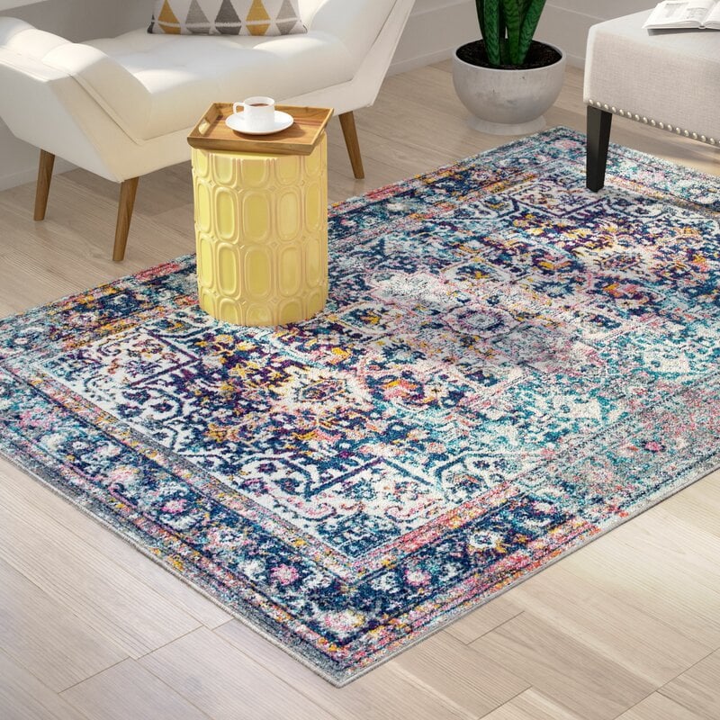 Burciaga Oriental Blue Area Rug