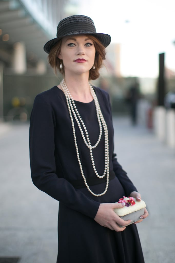 Who said hats couldn't be super chic? A low chignon makes this one fit for a night out.