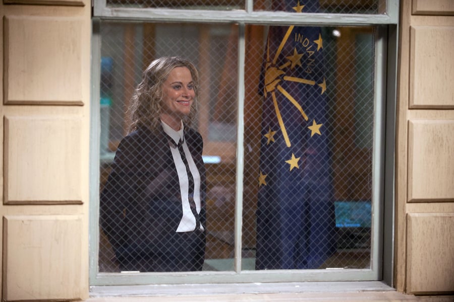 Leslie gazes out onto that storied courtyard.