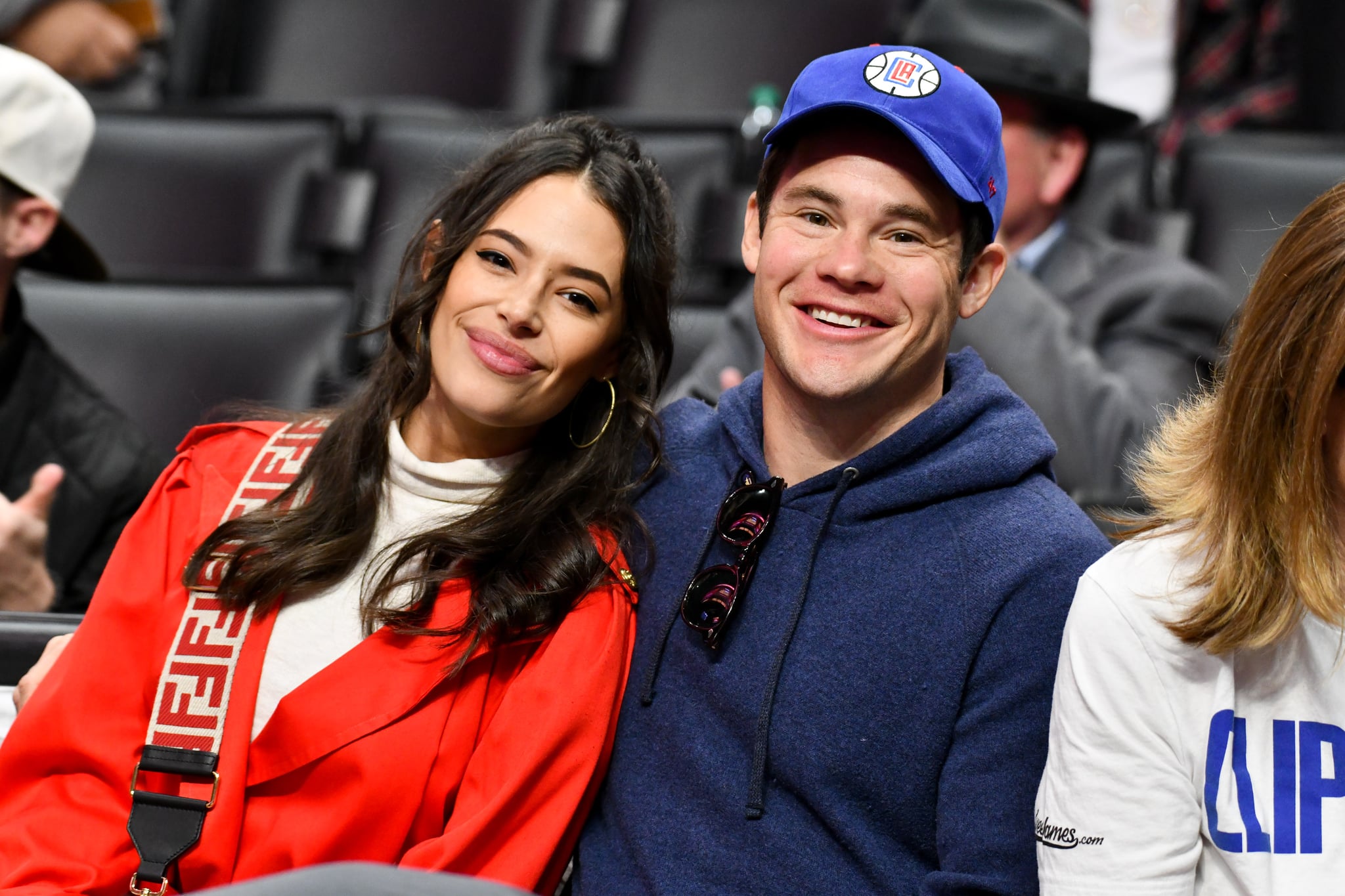 LOS ANGELES, CALIFORNIA - MARCH 08: Chloe Bridges and Adam DeVine attend a basketball game between the Los Angeles Clippers and the Los Angeles Lakers at Staples Centre on March 08, 2020 in Los Angeles, California. (Photo by Allen Berezovsky/Getty Images)