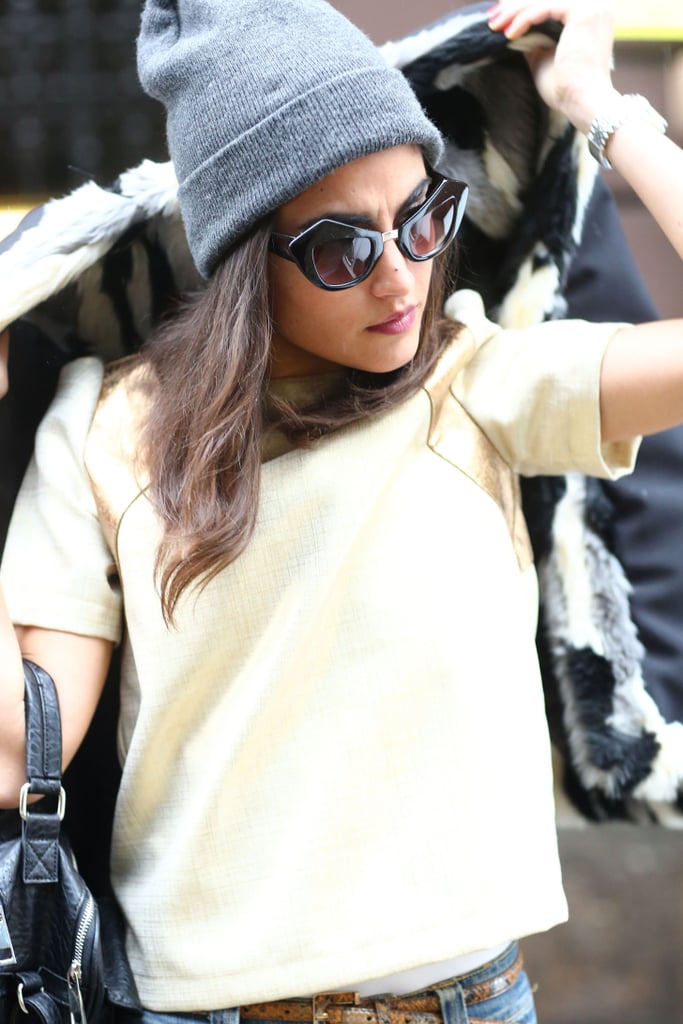 Her beanie says "cool girl" — her sunglasses say "glamazon." Street