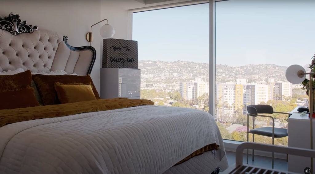 Her elegant bedroom also offers sweeping city views, and she saved a customized Balenciaga shopping bag to decorate her dresser.