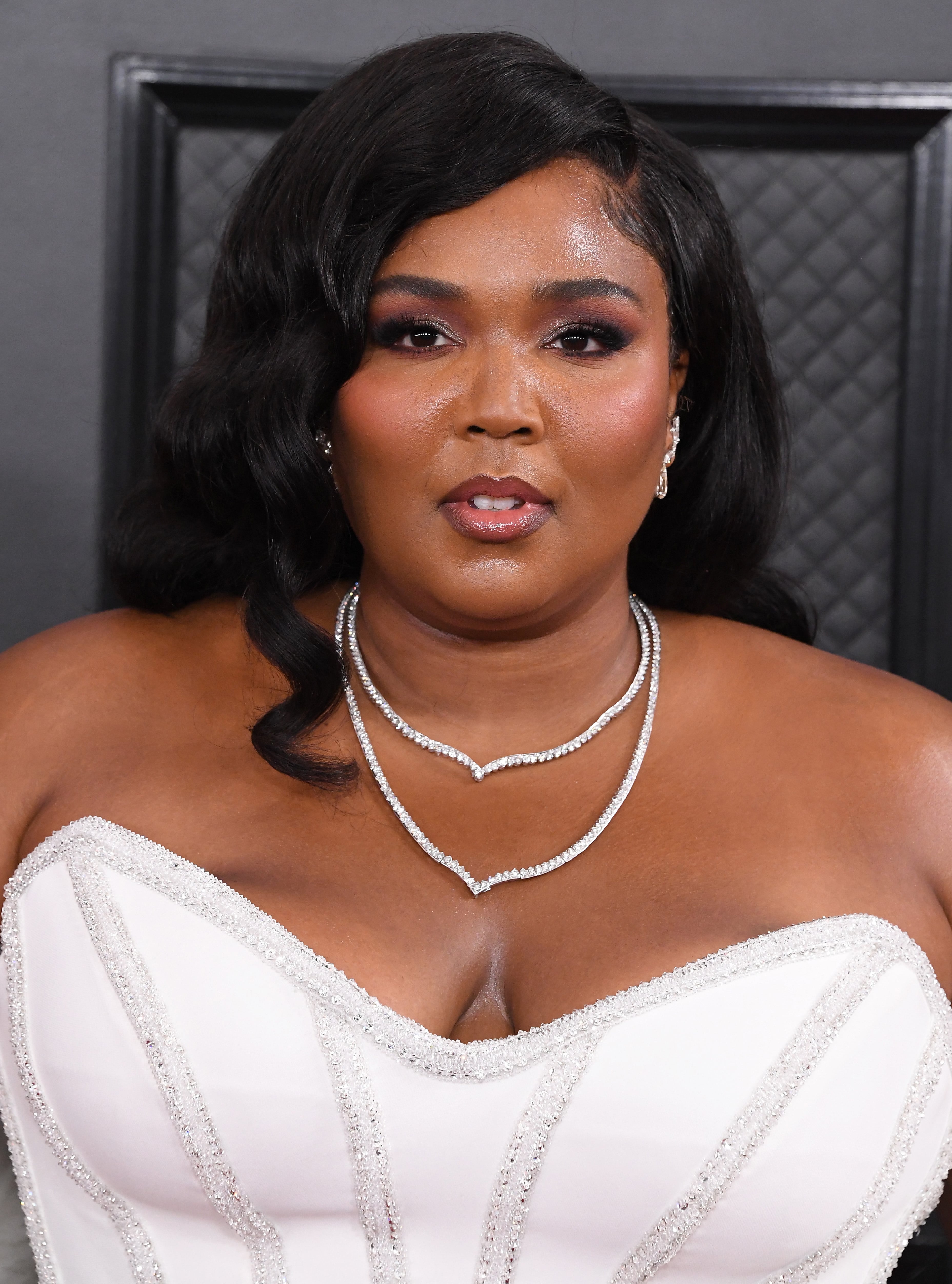 Lizzo's Head Full of Gucci Clips Is Probably Worth More Than My