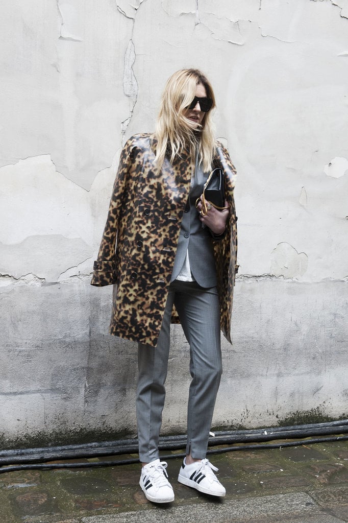 This Paris showgoer edged up her normcore look with leopard print. Brilliant.