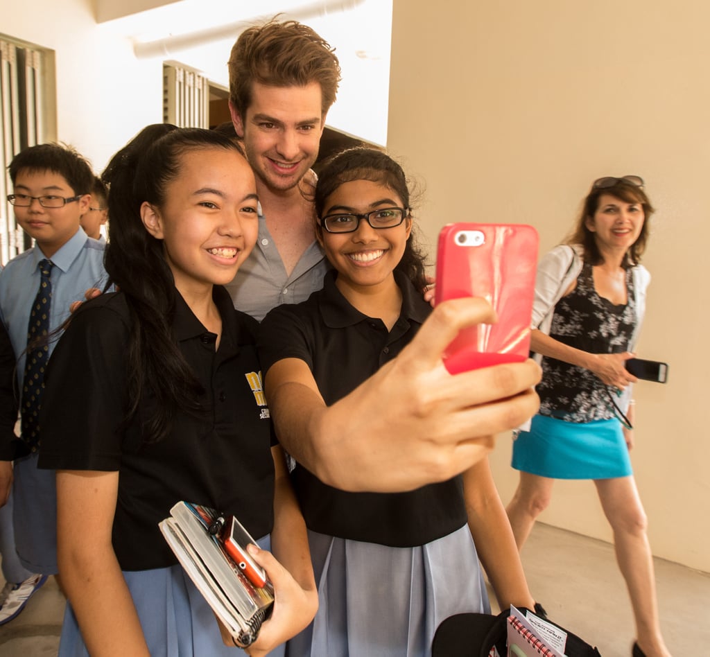 He snapped selfies with fans at a Singapore school in March 2014.