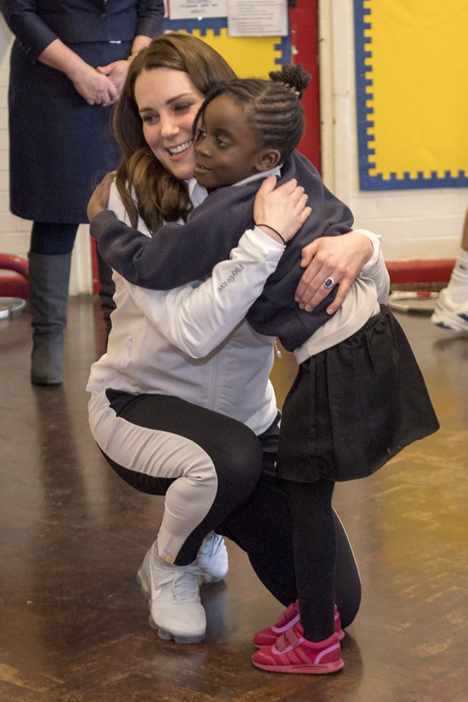 Kate gave a big hug to a little girl at the Bond Primary School in January 2018.