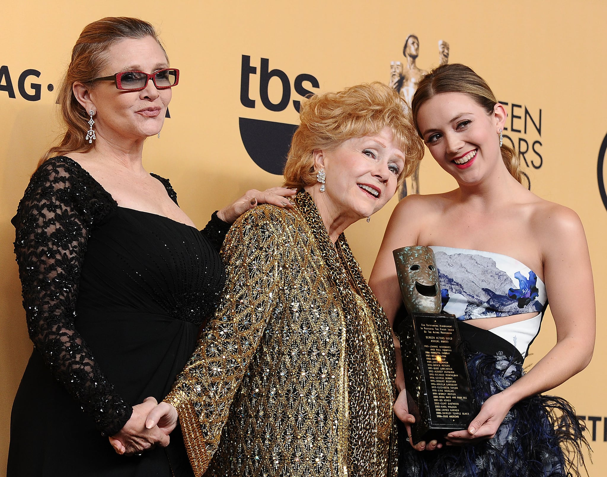 LOS ANGELES, CA - JANUARY 25:  (L-R) Carrie Fisher, Debbie Reynolds and Billie Catherine Lourd pose in the press room at the 21st annual Screen Actors Guild Awards at The Shrine Auditorium on January 25, 2015 in Los Angeles, California.  (Photo by Jason LaVeris/FilmMagic)