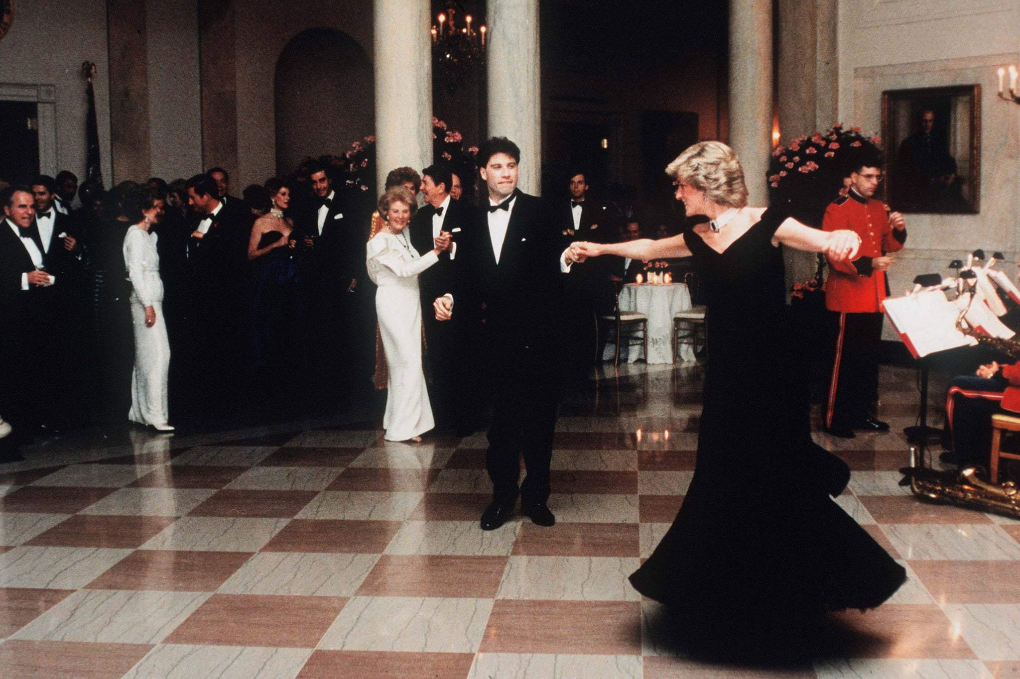 WASHINGTON, UNITED STATES - NOVEMBER 09:   (FILE PHOTO) Diana, Princess Of Wales, watched by President Ronald Reagan and wife Nancy,  dances with John Travolta at the White House, USA  on November 9, 1985.  Diana is wearing a midnight blue velvet dress by designer Victor Edelstein. (Photo by Anwar Hussein/WireImage)On July 1st  Diana, Princess Of Wales would have celebrated her 50th BirthdayPlease refer to the following profile on Getty Images Archival for further imagery. http://www.gettyimages.co.uk/Search/Search.aspx?EventId=107811125&EditorialProduct=ArchivalFor further images see also:Princess Diana:http://www.gettyimages.co.uk/Account/MediaBin/LightboxDetail.aspx?Id=17267941&MediaBinUserId=5317233Following Diana's Death:http://www.gettyimages.co.uk/Account/MediaBin/LightboxDetail.aspx?Id=18894787&MediaBinUserId=5317233Princess Diana  - A Style Icon:http://www.gettyimages.co.uk/Account/MediaBin/LightboxDetail.aspx?Id=18253159&MediaBinUserId=5317233