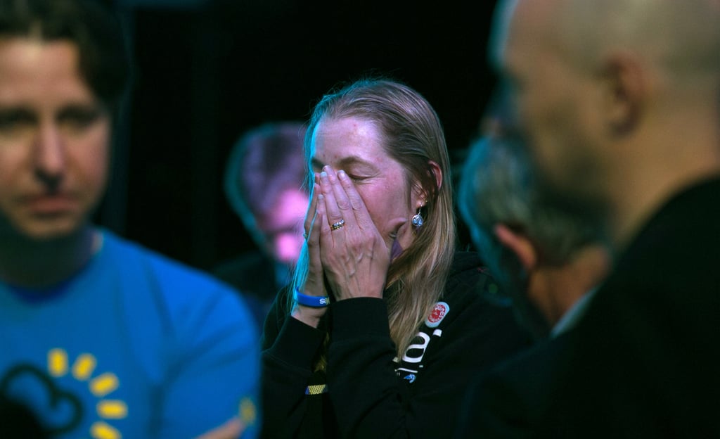 A "Yes" supporter listened to the results during a party in Edinburgh.