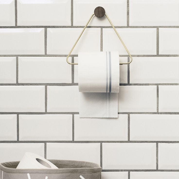 Even the most mundane household items, like toilet paper holders, can become the focal point of a room. This brass and wood beauty from Ferm Living ($33, originally $44) is simple but stunning.  
— Angela Elias, editor