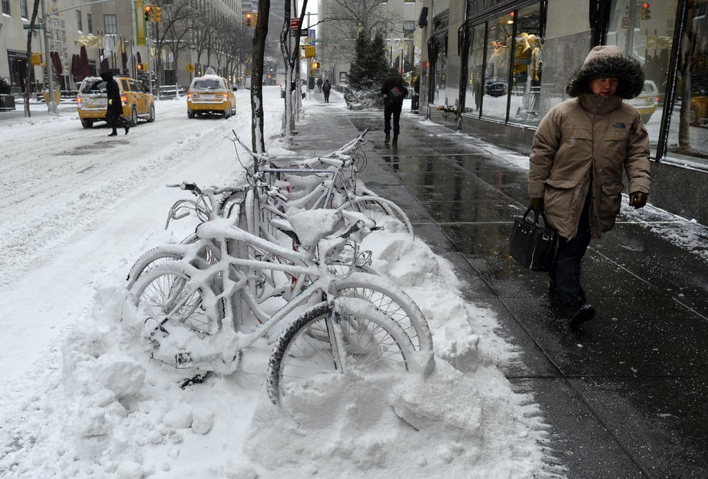 A pile of bicycles was buried beneath inches of snow in NYC after the Winter storm hit the city.