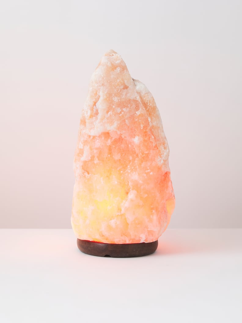 A Decorative Light: Himalayan Salt Lamp With Wood Base