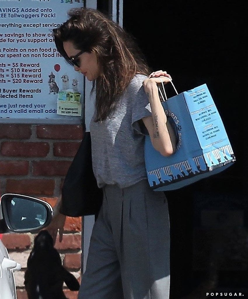 Angelina Jolie Wearing Gray Trousers