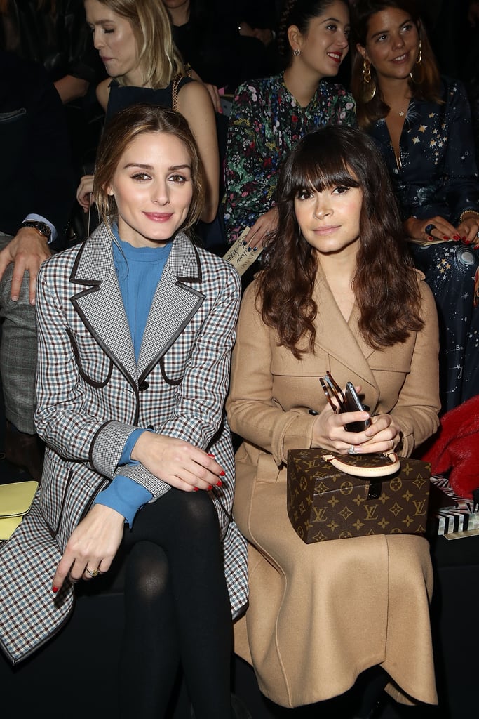 And sitting front row, Olivia was all smiles next to the ever-chic Miroslava Duma.