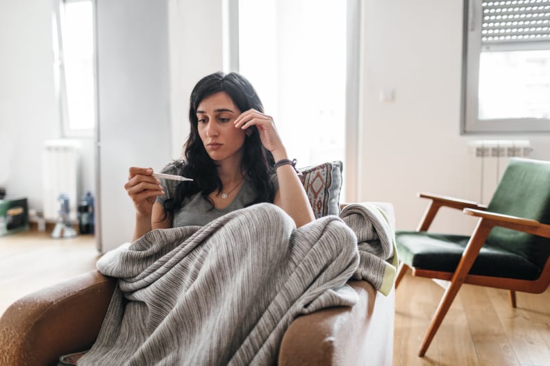 Young woman sick at home.