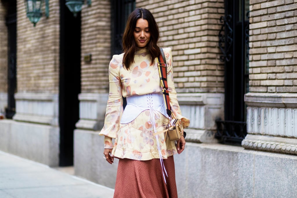 A Corset Over A Tunic Blouse And Skirt