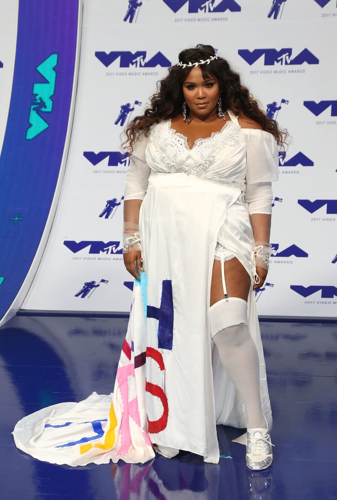 Bearing the title of one of her biggest songs, "Truth Hurts," this wedding-style gown makes Lizzo look like a bride worthy of no other. While her jeweled crown ties the whole look together, we also love that she kept the look casual in a pair of sparkling white and silver sneakers.