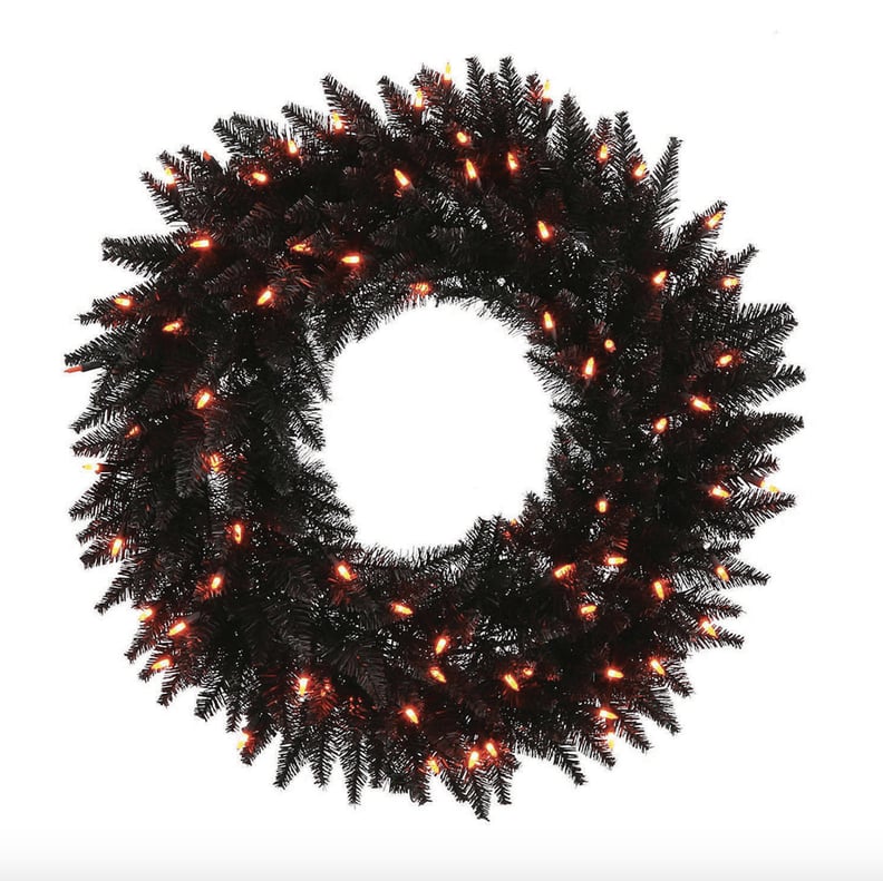 Black Fir Wreath With Orange Lights