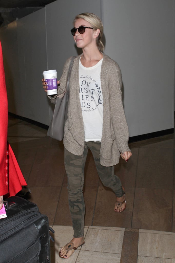 Julianne Hough stayed in neutral territories in camouflage jeans, a white tee, and beige cardigan at the airport.