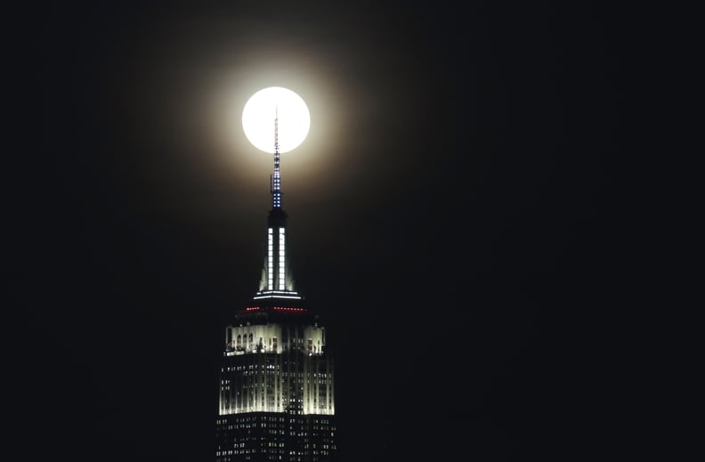 JERSEY CITY, NJ - DECEMBER 12: The full Cold Moon rises behind the Empire State Building in New York City on December 12, 2019 as seen from Jersey City, New Jersey. (Photo by Gary Hershorn/Getty Images)