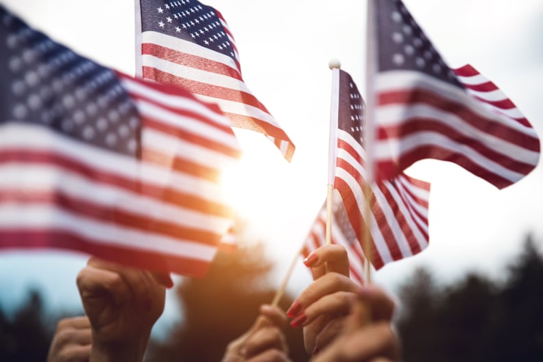 Group of people celebrating with national US flag