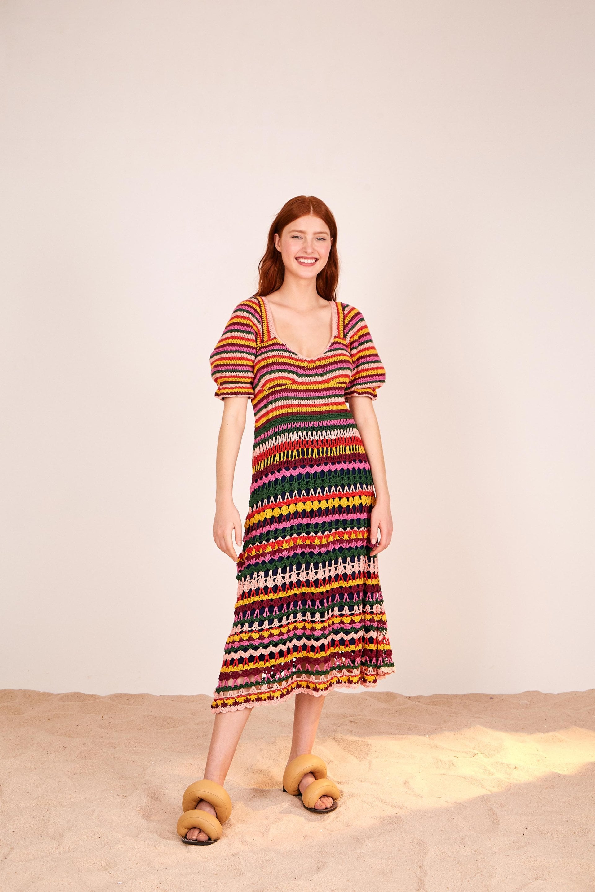 gal gadot crochet dress Gal Gadot Cradles Her Baby Bump in a Rainbow Crochet Dress