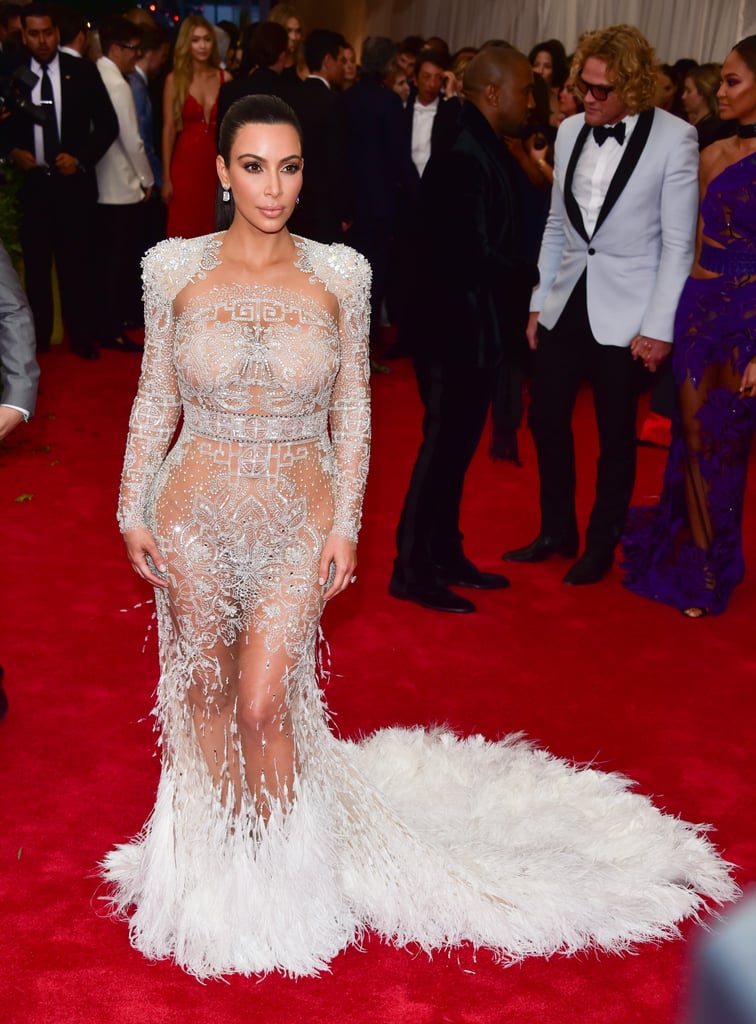 Kim Kardashian adorned her curves with feathers and embellishments in all the right places in her Roberto Cavalli gown.