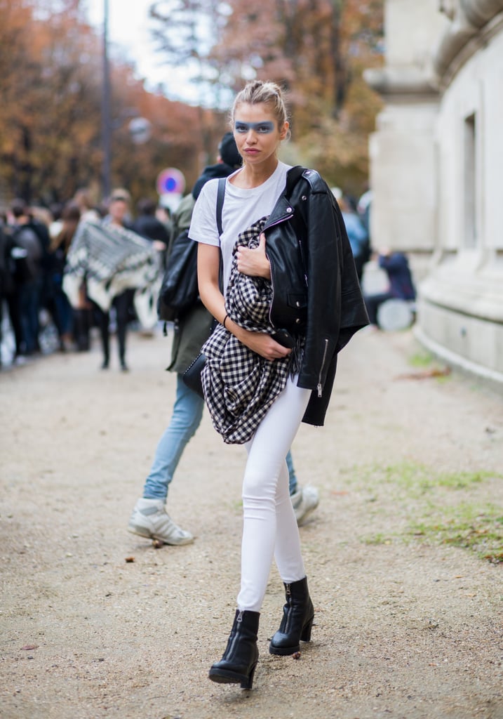 What's special about Stella Maxwell's boots is the front zipper, which slides all the way down. The model chose to wear her shoe with white denim during Paris Fashion Week.