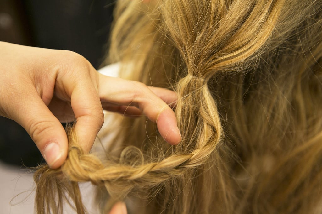 To hide the elastic, take a small section of hair from the ponytail and create a loose braid.