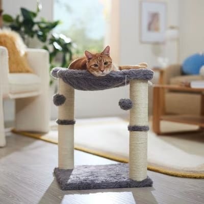Frisco Faux-Fur Cat Tree ($27, originally $33)
"My cats have sat in just about every cat hammock, tree, and basket on the market, and I can promise that this has been their favorite — hands down. There must be something about the plush fabric, plus the addition of scratching posts and play toys on the side that make this one feel special for them. What's especially cute is how much they love to cozy up in it together. Even though it doesn't look big enough for two cats, they make it work." — SW