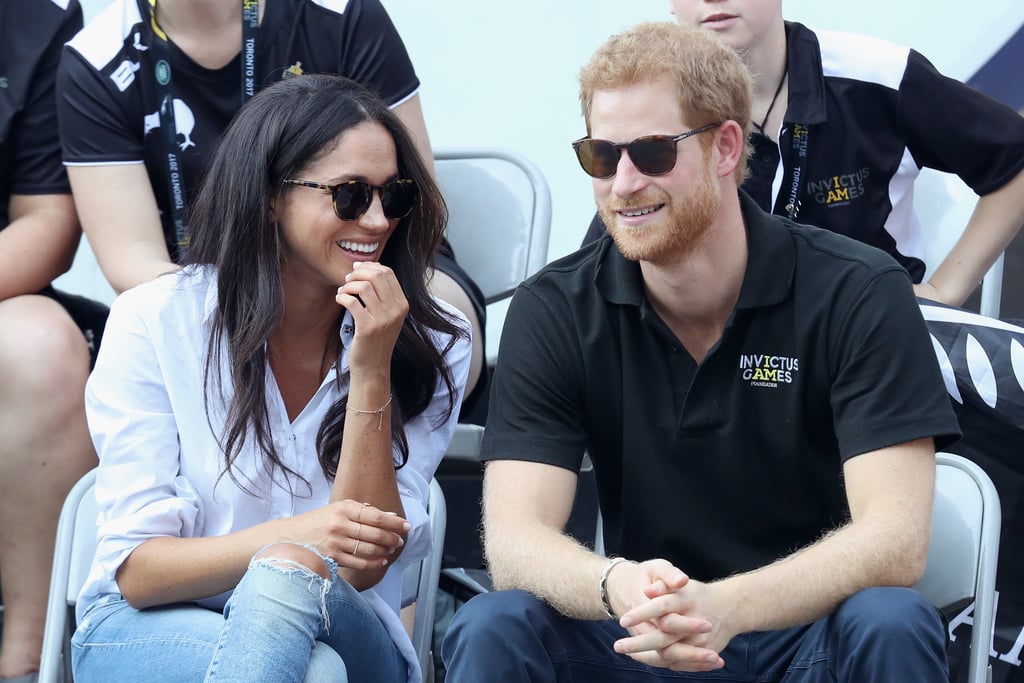 Meghan Markle Looking at Prince Harry Pictures