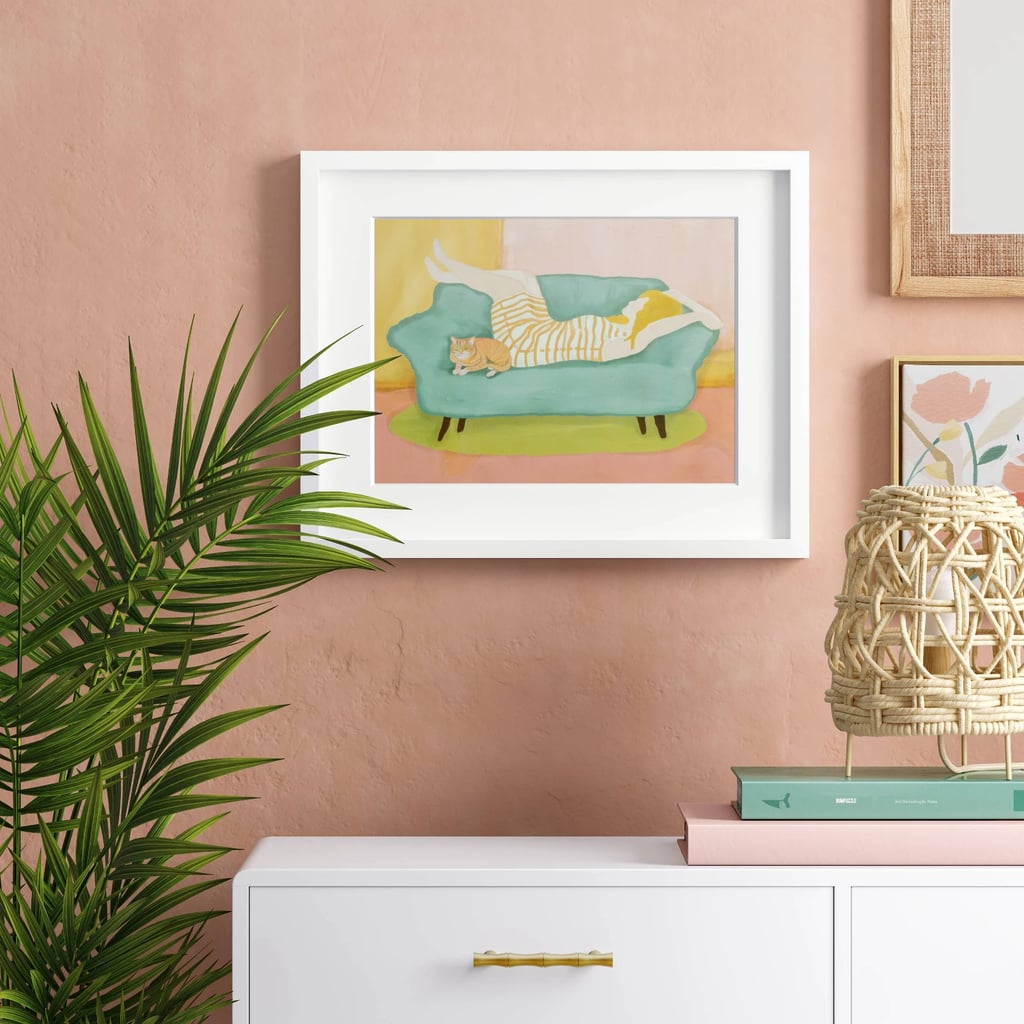 Woman on Couch With Cat Framed Wall Art