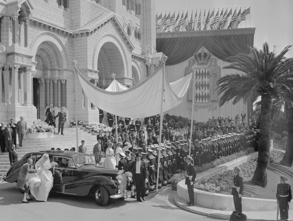 Nearly 2,000 journalists packed into Monaco for the wedding. Every newspaper in the world wanted their top reporters covering the "wedding of the century," but Monaco was unprepared for the onslaught of the press. A local school had been converted into a makeshift press center, equipped with new typewriters and phone booths, but reporters complained that the arrangements were sorely lacking.
They got married not once but twice. Due to Napoleonic Code and Roman Catholic church rules, Grace and Prince Rainier had to marry in both a civil ceremony on April 18 and a religious ceremony the day afterward. The first was only 15 minutes long and was conducted in the Palace Throne Room. Grace received more than 140 titles upon its completion, which then took another 25 minutes to read aloud.
Only two dozen reporters were allowed to cover the actual ceremony. Although Grace and Prince Rainier welcomed a handful into their nuptials, most were kept waiting for shreds of news outside the palace.
MGM planned the entire event. The Hollywood studio Grace worked for, Metro-Goldwyn-Mayer, oversaw everything from Grace's dress to the lighting inside the cathedral and later put all the footage of the event together for a movie about her wedding. One of Grace's bridesmaids later remarked, "The day, like the bride-to-be herself, was a creation brought to us through the joint production efforts of enormous willpower, Metro-Goldwyn-Mayer, and God." 
There was a dress rehearsal of the wedding days before the actual ceremony. MGM had technicians hold a dress rehearsal of the ceremony to ensure lighting and sound were up to snuff. They also had a team of the studio's best hair and makeup staff accompany Kelly on the Constitution and into Monaco afterward so that she was always camera-ready.