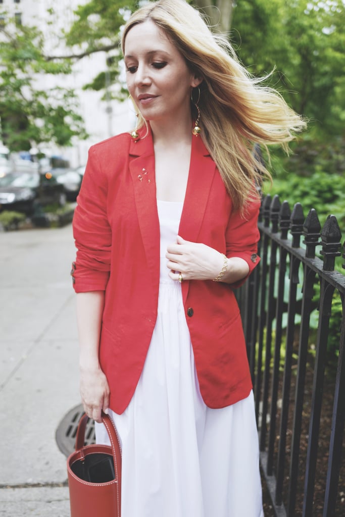 To keep things comfy, I slid into a pair of flat leather sandals and finished with a structured bucket bag, mismatched statement earrings, and unique lapel pins for a modern Carrie Bradshaw moment. Fun, yes?