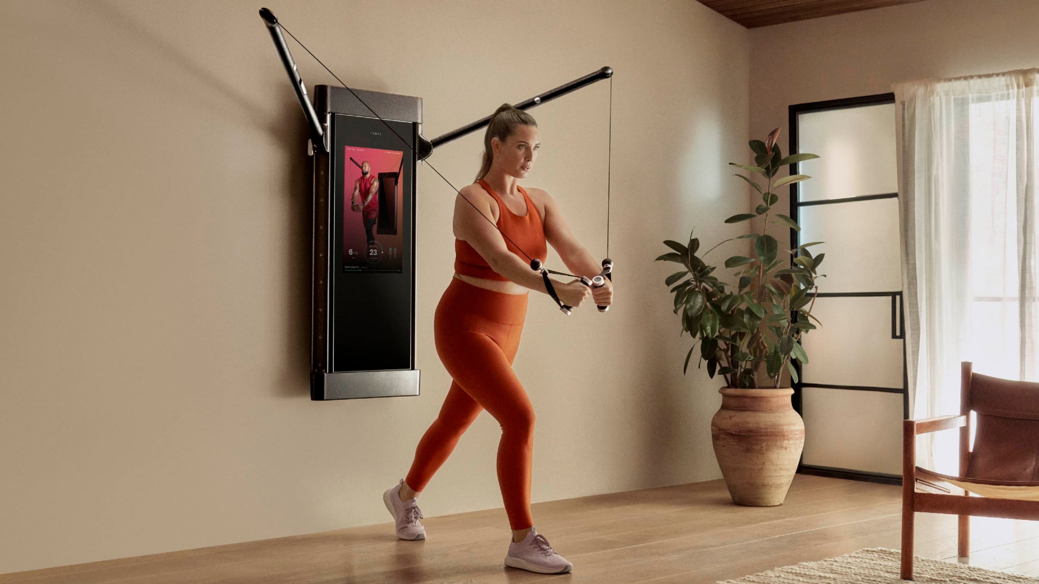 woman working out with Tonal 