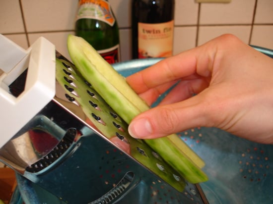 Grating the cucumber (a microplane grater works better)