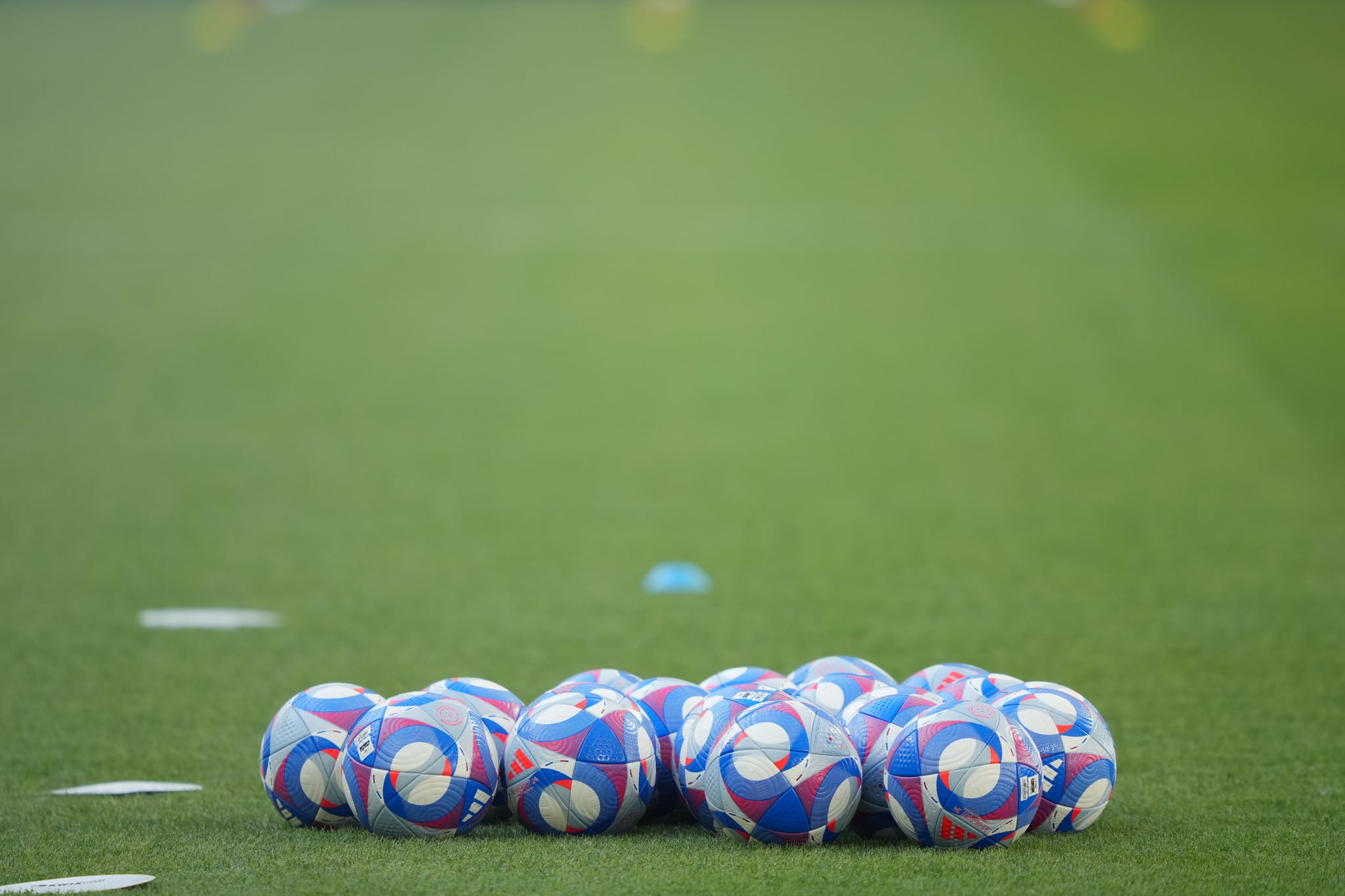 MARSEILLE, FRANCE - JULY 31: Soccer balls lay on the field before the Women's group B match between Australia and the United States during the Olympic Games Paris 2024 at Stade de Marseille on July 31, 2024 in Marseille, France. (Photo by John Todd/ISI/Getty Images)
