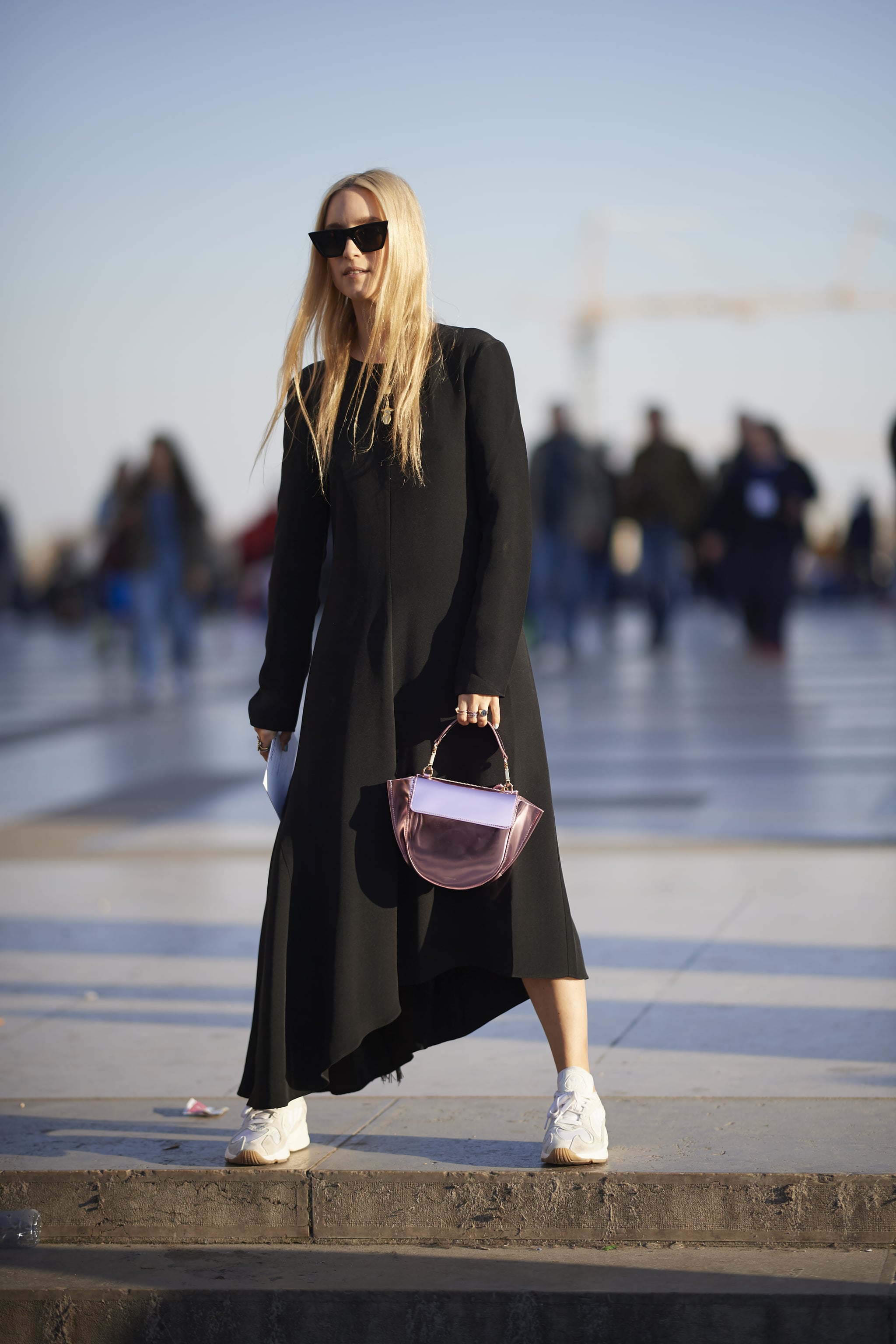 Style an asymmetrical maxi with low rise sneakers. This Is How